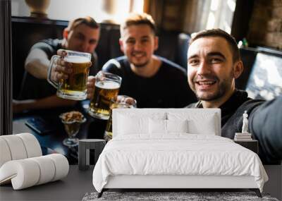 happy male friends drinking beer and taking selfie with smartphone at bar or pub Wall mural